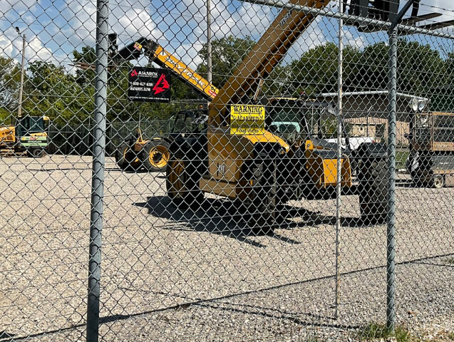 Chain Link Fence Surrounding Construction Equipment
