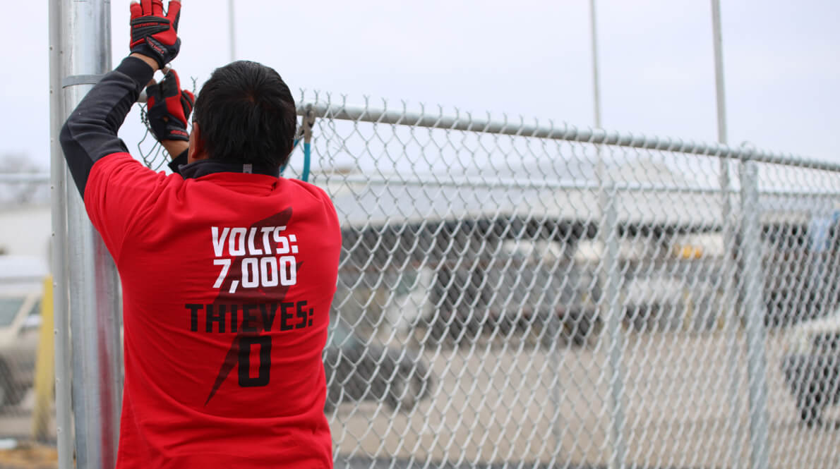 AMAROK employee installing an electric fence