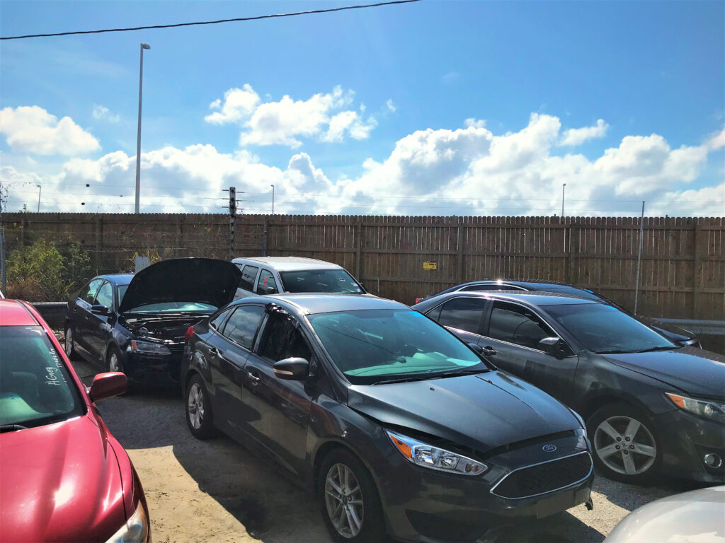 Auto auction lot with an electric fence