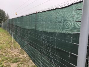 Electric fence surrounding Rochester Farm