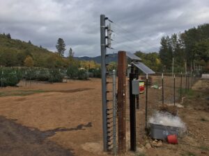An electric fence surrounding a cannabis farm