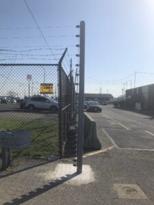 Electric Fence Surrounding a Car Rental Agency