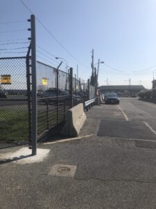 Electric Fence Surrounding a Car Rental Agency