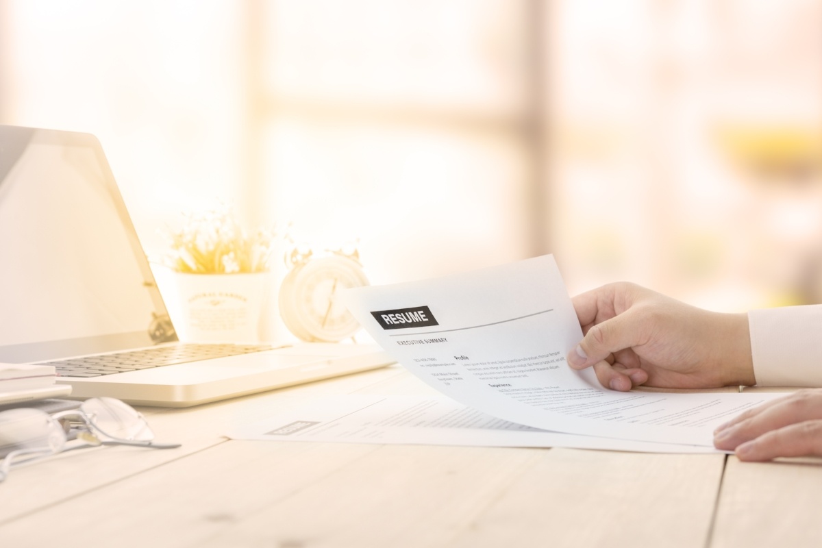 An Employee is Looking at a Resume