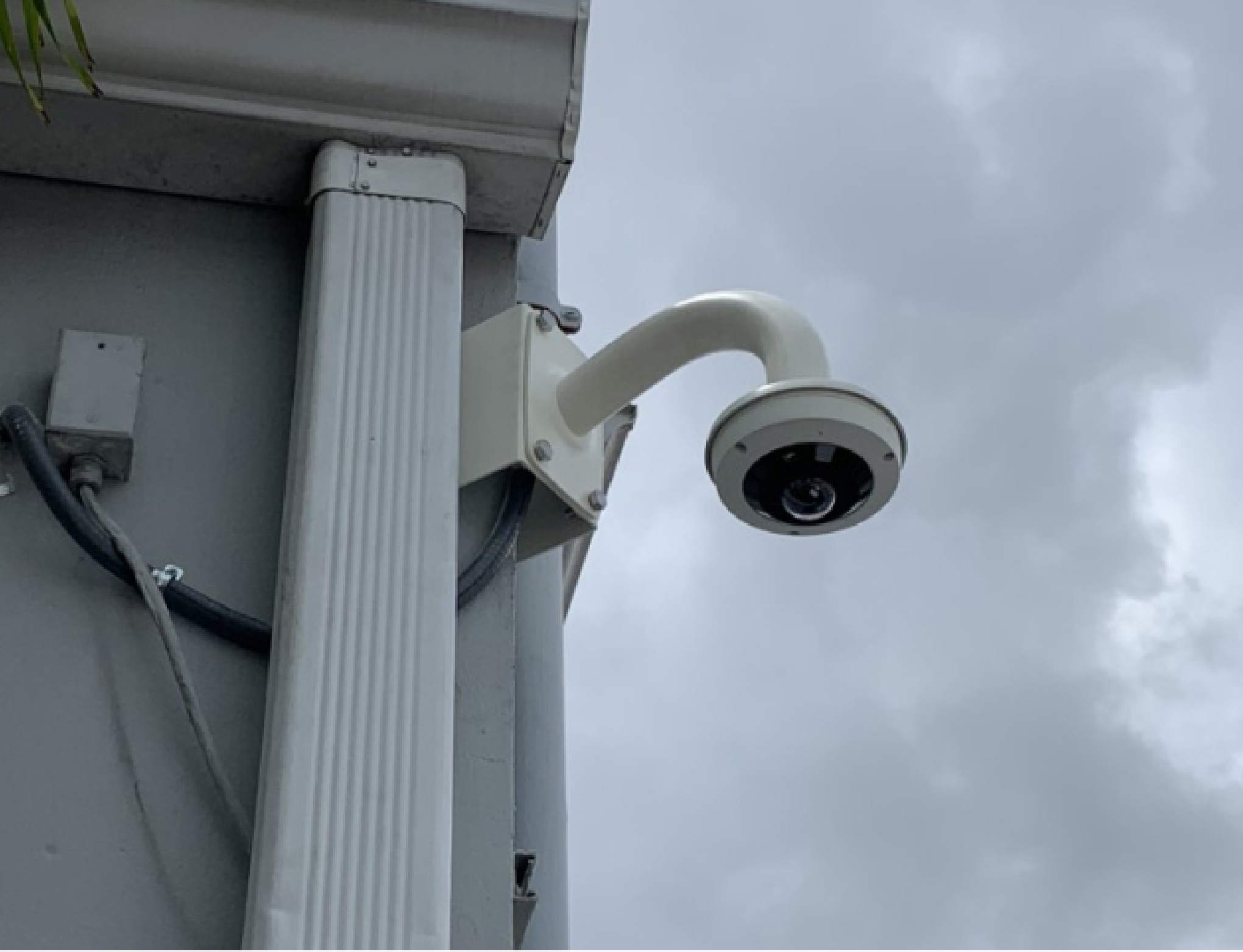 a security camera mounted on the side of a building