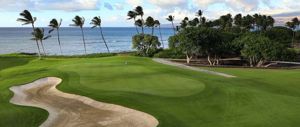 A Golf Course with the Ocean in the Background